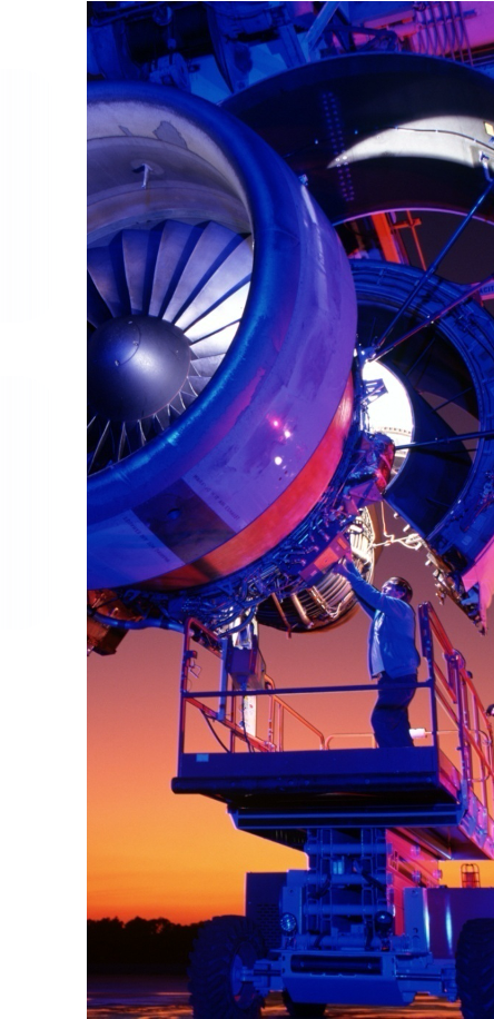 Aircraft engine maintenance at sunset