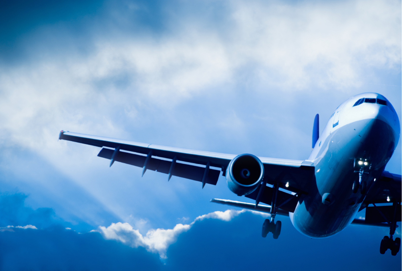 Commercial aircraft in flight representing Delta Omega Group leasing services